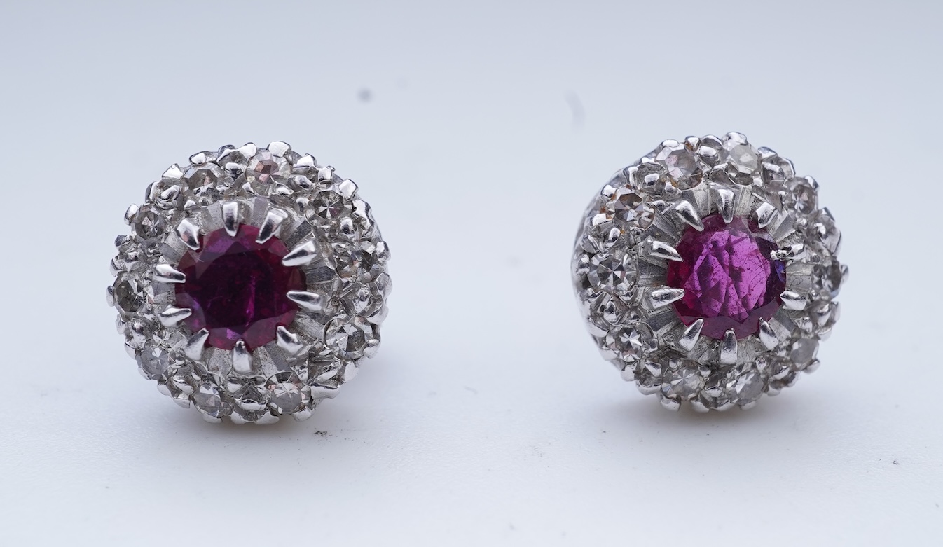A pair of ruby and diamond earrings